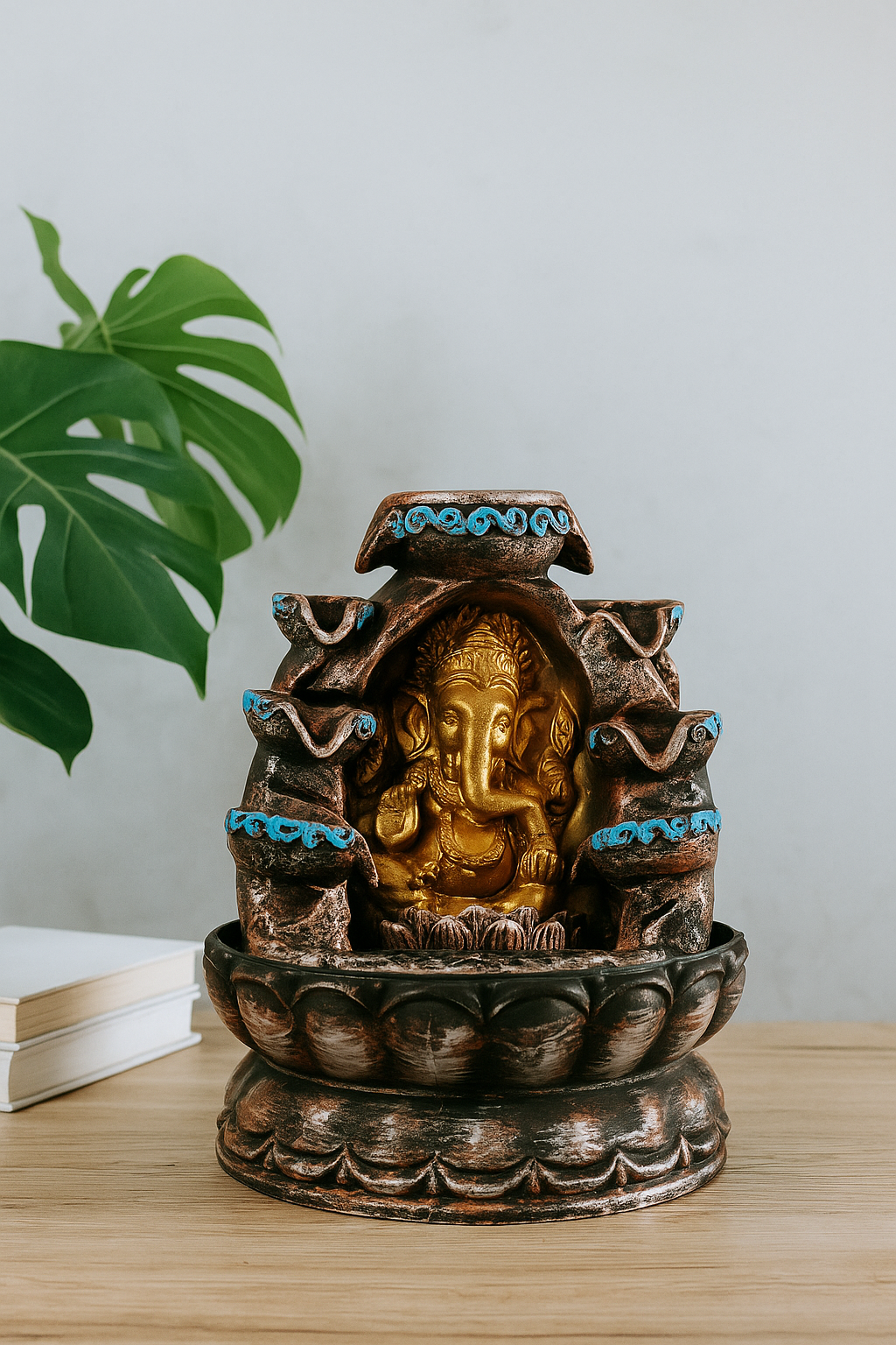 20250904_1438_Modern20Ganesha20Display_remix_01k49zmb3de1paehmf9fwh98ma.png Golden Ganesha Water Fountain with Blue Accents - Image 1